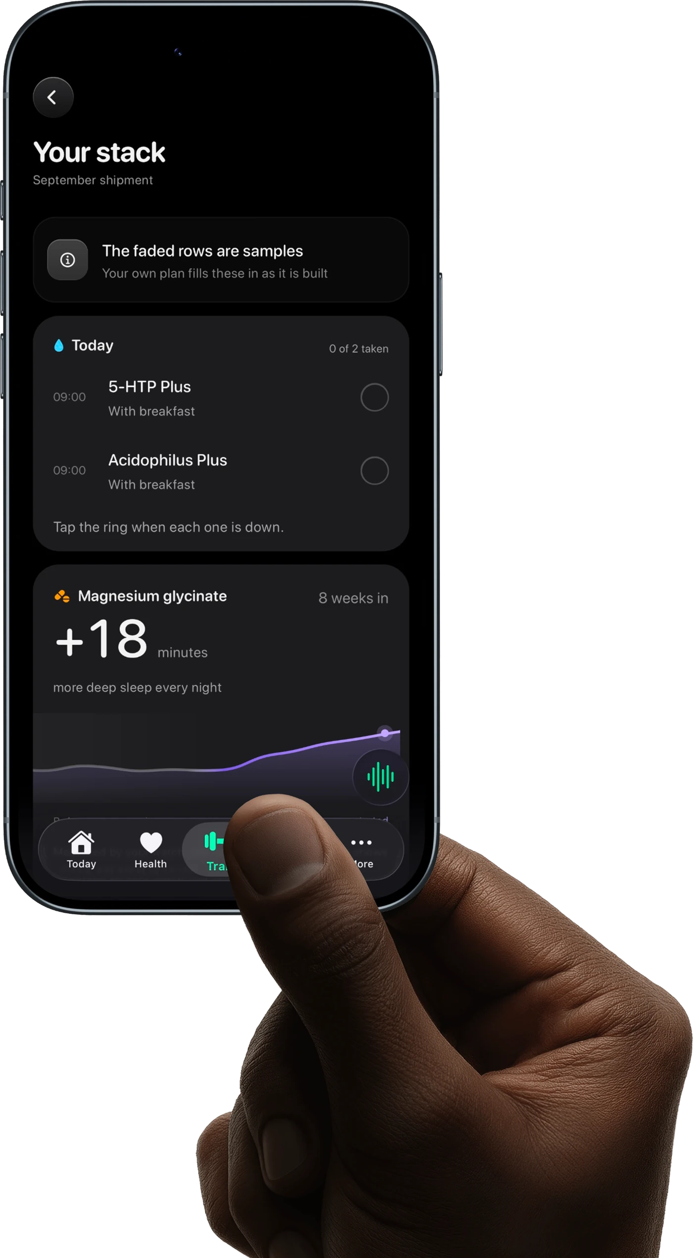 A hand holding an iPhone showing the VitaOS supplement stack